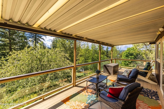 7485 E Revilo Point Rd, Hayden, ID 83835 - wooden terrace featuring outdoor lounge area and view of wooded area