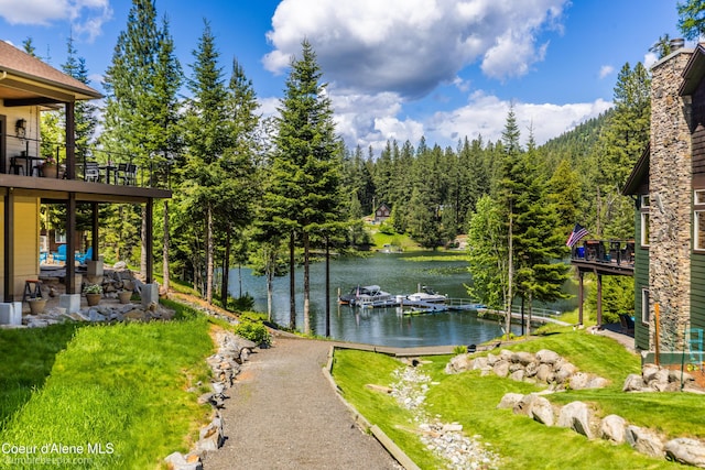 7485 E Revilo Point Rd, Hayden, ID 83835 - view of grassy yard featuring a water view and a boat dock