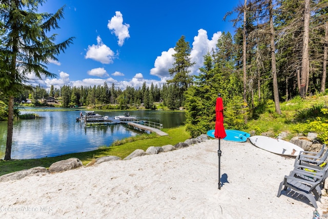 7485 E Revilo Point Rd, Hayden, ID 83835 - water view featuring a dock and a forest