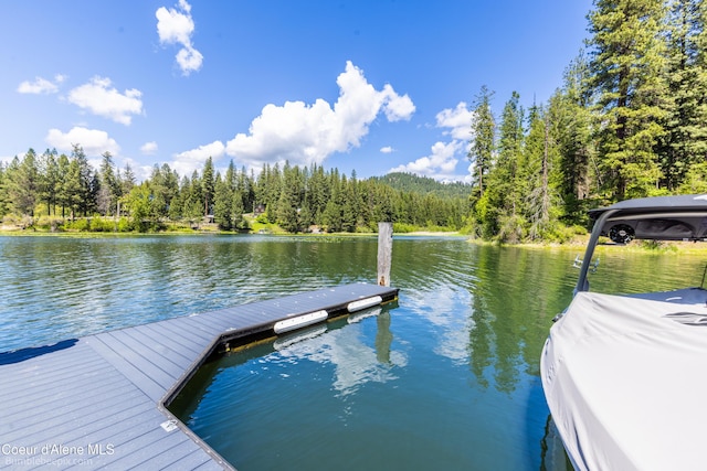 7485 E Revilo Point Rd, Hayden, ID 83835 - dock area featuring a water view and a wooded view