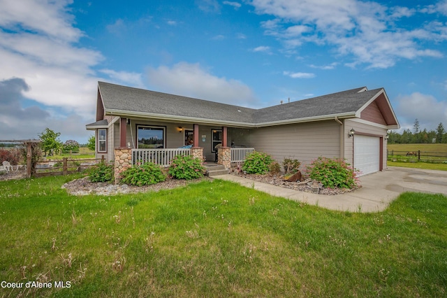 222 E Remington Rd, Athol, ID 83801 - single story home with a porch, a garage, driveway, roof with shingles, and stone siding