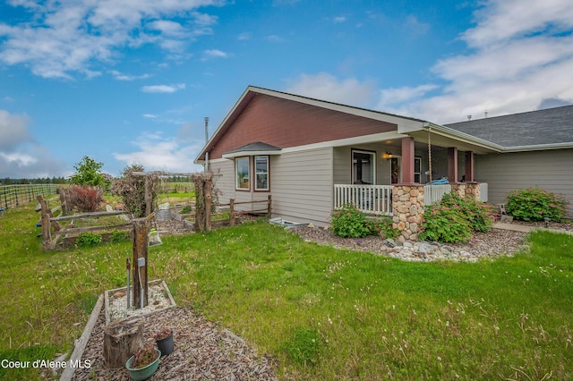 222 E Remington Rd, Athol, ID 83801 - view of property exterior featuring covered porch and a garden