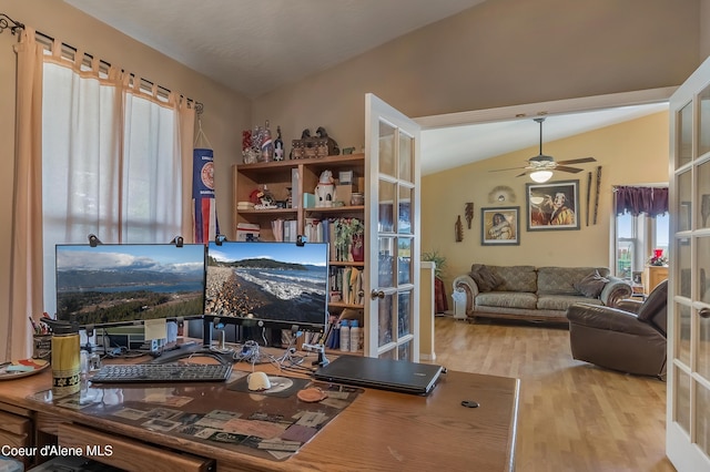 222 E Remington Rd, Athol, ID 83801 - living area featuring wood finished floors, ceiling fan, a desk, french doors, and vaulted ceiling