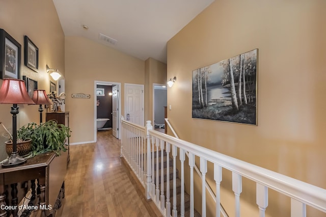 222 E Remington Rd, Athol, ID 83801 - hall with vaulted ceiling, wood finished floors, and an upstairs landing