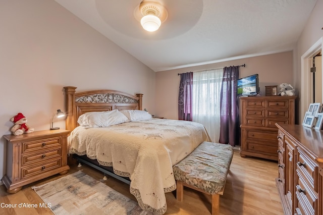 222 E Remington Rd, Athol, ID 83801 - bedroom featuring vaulted ceiling, light wood finished floors, and a ceiling fan
