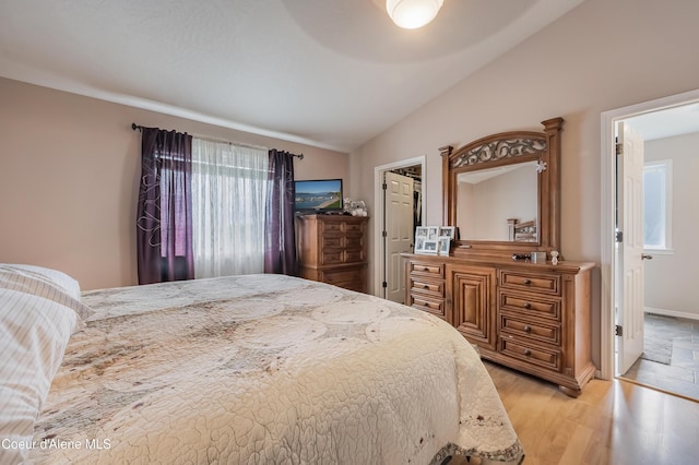 222 E Remington Rd, Athol, ID 83801 - bedroom featuring lofted ceiling, light wood-style flooring, and ceiling fan