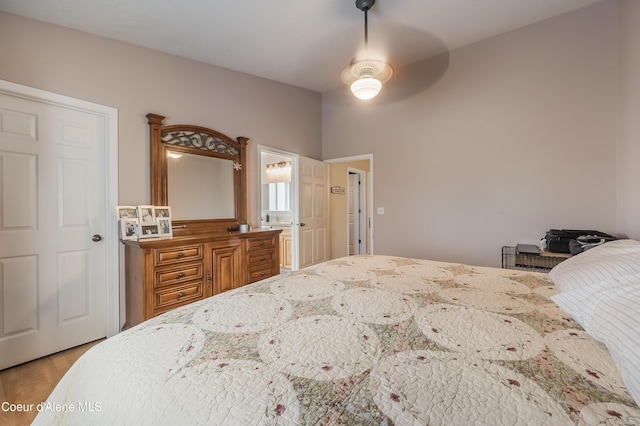 222 E Remington Rd, Athol, ID 83801 - bedroom with light wood-style floors, a ceiling fan, and connected bathroom