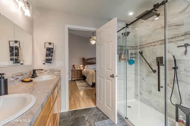 222 E Remington Rd, Athol, ID 83801 - ensuite bathroom with a shower stall, double vanity, and tasteful backsplash