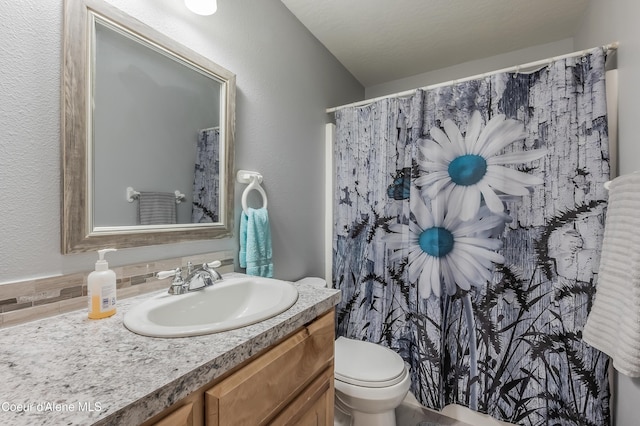 222 E Remington Rd, Athol, ID 83801 - full bath with decorative backsplash, toilet, vanity, a textured wall, and a shower with curtain