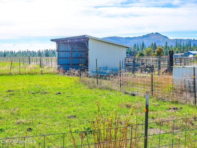 222 E Remington Rd, Athol, ID 83801 - view of yard featuring a pole building, an outbuilding, a mountain view, and a view of rural / pastoral area