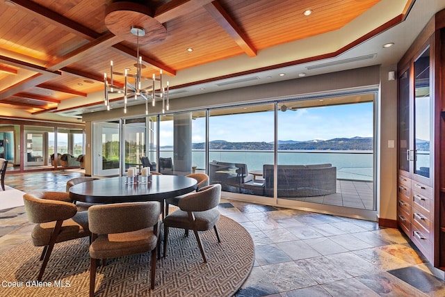 2051 S Island Green Dr, Coeur Dalene, ID 83814 - dining area with wood ceiling with exposed beams, stone tile floors, plenty of natural light, recessed lighting, and a chandelier