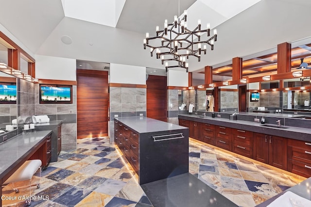2051 S Island Green Dr, Coeur Dalene, ID 83814 - bathroom with tile walls, vanity, and a chandelier
