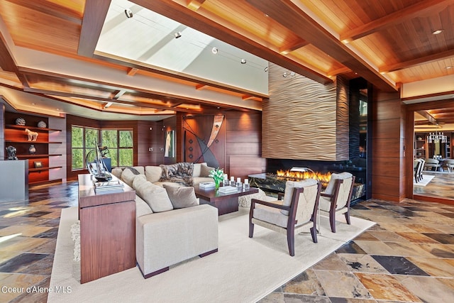 2051 S Island Green Dr, Coeur Dalene, ID 83814 - living area with a fireplace, wood walls, stone finish flooring, and wooden ceiling with exposed beams