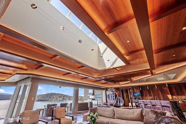 2051 S Island Green Dr, Coeur Dalene, ID 83814 - living room with coffered ceiling, a skylight, wood ceiling with exposed beams, and ceiling fan