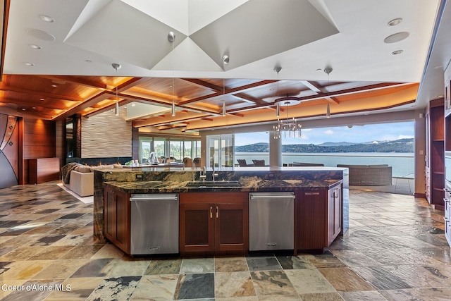 2051 S Island Green Dr, Coeur Dalene, ID 83814 - kitchen featuring coffered ceiling, open floor plan, stone tile floors, a center island, and dark stone counters