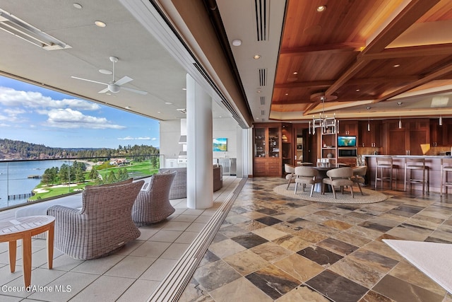 2051 S Island Green Dr, Coeur Dalene, ID 83814 - view of patio / terrace featuring ceiling fan and a water view