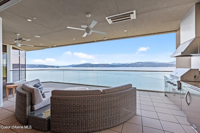 2051 S Island Green Dr, Coeur Dalene, ID 83814 - view of patio / terrace featuring grilling area, a water and mountain view, ceiling fan, and a balcony