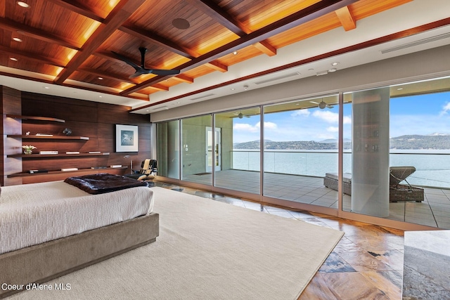 2051 S Island Green Dr, Coeur Dalene, ID 83814 - bedroom with wooden ceiling with exposed beams, access to outside, wood walls, a water and mountain view, and recessed lighting