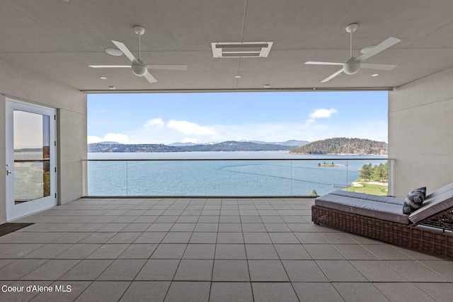 2051 S Island Green Dr, Coeur Dalene, ID 83814 - view of patio / terrace featuring a ceiling fan, a balcony, and a water and mountain view