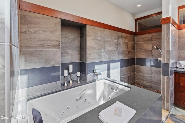 2051 S Island Green Dr, Coeur Dalene, ID 83814 - full bathroom featuring a tub with jets, recessed lighting, and tile walls