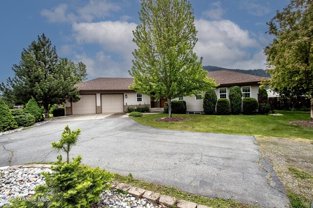 6264 N 15th St, Dalton Gardens, ID 83815 - ranch-style house with a garage, asphalt driveway, and roof with shingles