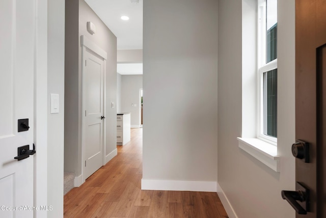 1670 Onyx Ct, Sandpoint, ID 83864 - corridor featuring light wood finished floors, baseboards, and recessed lighting
