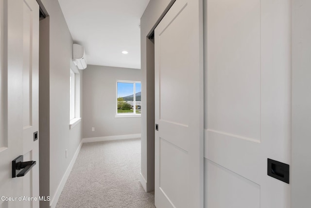 1670 Onyx Ct, Sandpoint, ID 83864 - hall with light colored carpet, a wall mounted air conditioner, baseboards, and recessed lighting