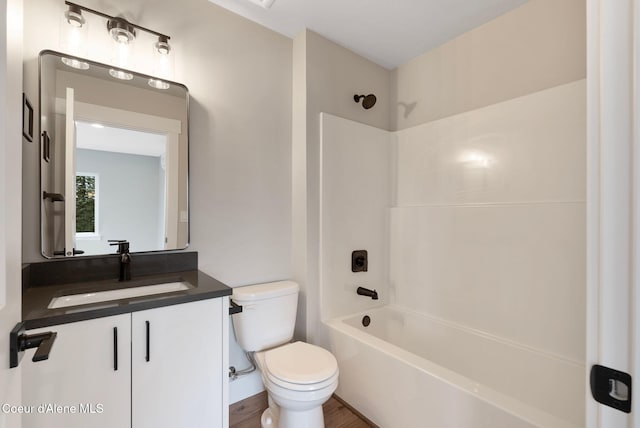 1670 Onyx Ct, Sandpoint, ID 83864 - bathroom featuring toilet, vanity, shower / bathtub combination, and wood finished floors
