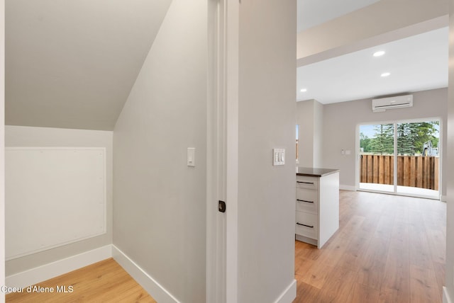 1670 Onyx Ct, Sandpoint, ID 83864 - bonus room featuring a wall unit AC, light wood-style floors, baseboards, and recessed lighting