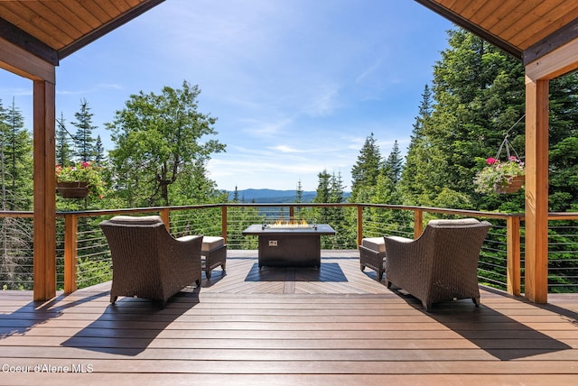 17378 N Freddi Rd, Rathdrum, ID 83858 - wooden deck with a mountain view and an outdoor fire pit