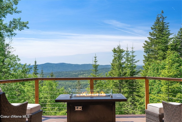 17378 N Freddi Rd, Rathdrum, ID 83858 - wooden deck featuring a fire pit and a mountain view
