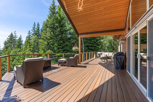 17378 N Freddi Rd, Rathdrum, ID 83858 - wooden deck with outdoor lounge area, grilling area, and outdoor dining space