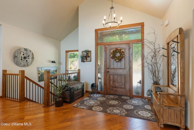 17378 N Freddi Rd, Rathdrum, ID 83858 - foyer with a chandelier, high vaulted ceiling, and wood finished floors