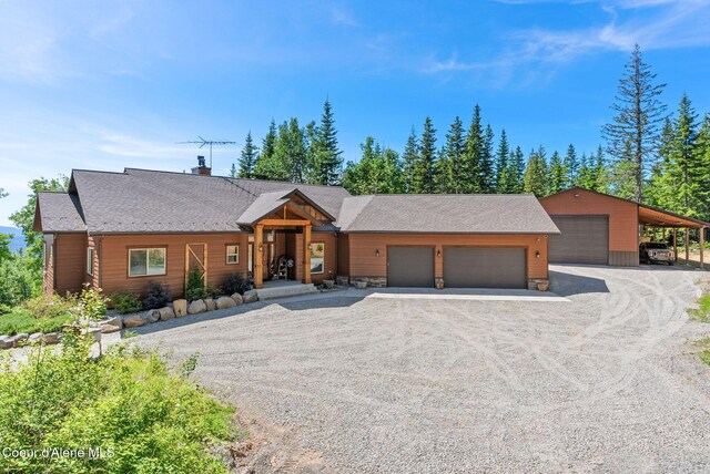17378 N Freddi Rd, Rathdrum, ID 83858 - view of front of property featuring driveway, a garage, and a chimney