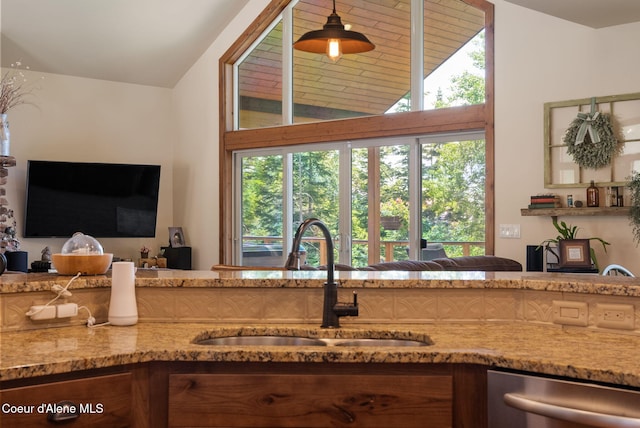 17378 N Freddi Rd, Rathdrum, ID 83858 - kitchen featuring a sink, dishwasher, vaulted ceiling, light stone counters, and hanging light fixtures