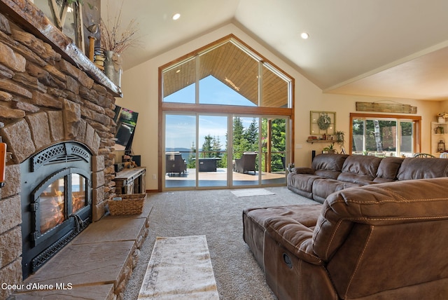 17378 N Freddi Rd, Rathdrum, ID 83858 - living room with carpet, a stone fireplace, healthy amount of natural light, high vaulted ceiling, and recessed lighting