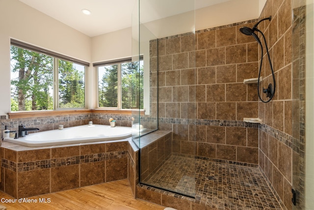 17378 N Freddi Rd, Rathdrum, ID 83858 - bathroom with a stall shower, plenty of natural light, a garden tub, and recessed lighting