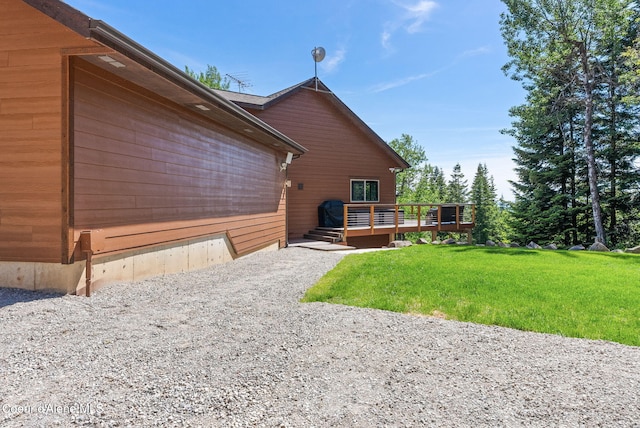 17378 N Freddi Rd, Rathdrum, ID 83858 - back of house with a lawn and a deck