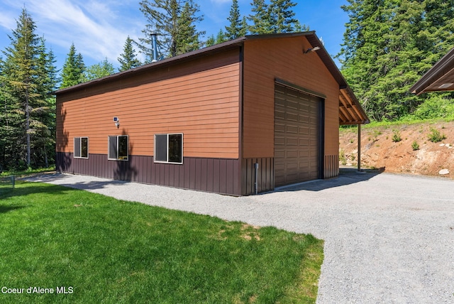 17378 N Freddi Rd, Rathdrum, ID 83858 - view of home's exterior featuring a detached garage, an outdoor structure, and a yard