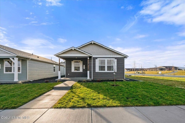 5082 E Norma Ave, Post Falls, ID 83854 - view of front of home with covered porch and a front lawn