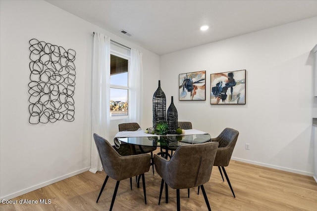 5082 E Norma Ave, Post Falls, ID 83854 - dining room with light wood-style floors, baseboards, and recessed lighting