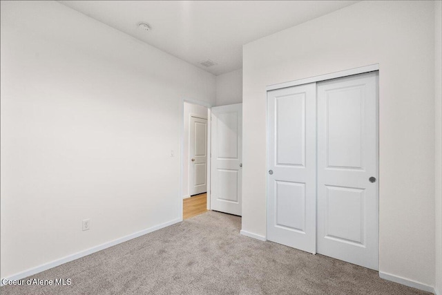 5082 E Norma Ave, Post Falls, ID 83854 - unfurnished bedroom featuring carpet, a closet, and baseboards