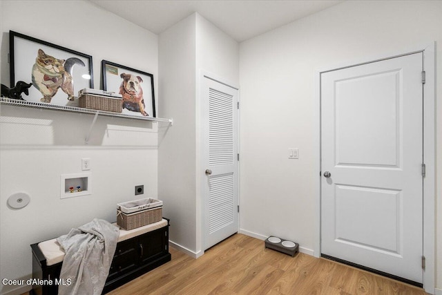 5082 E Norma Ave, Post Falls, ID 83854 - washroom featuring electric dryer hookup, hookup for a washing machine, light wood-style floors, and baseboards