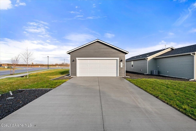 5082 E Norma Ave, Post Falls, ID 83854 - view of front of house with a front yard, central AC, and a garage