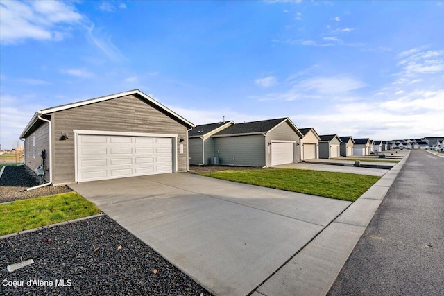 5082 E Norma Ave, Post Falls, ID 83854 - ranch-style home featuring a detached garage and a residential view