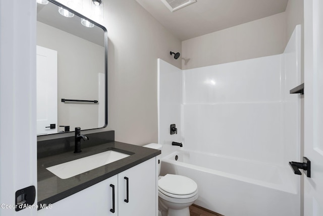 1674 Onyx Ct, Sandpoint, ID 83864 - bathroom with vanity, toilet, and shower / washtub combination
