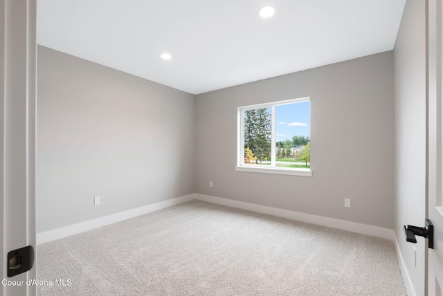 1674 Onyx Ct, Sandpoint, ID 83864 - spare room featuring light carpet, recessed lighting, and baseboards