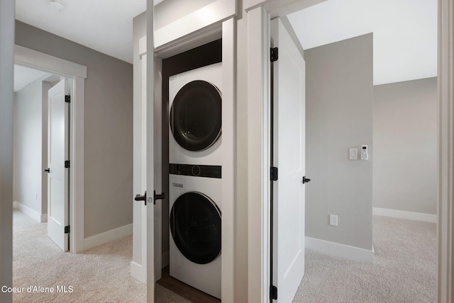 1674 Onyx Ct, Sandpoint, ID 83864 - laundry room with estacked washer and dryer, carpet, and baseboards