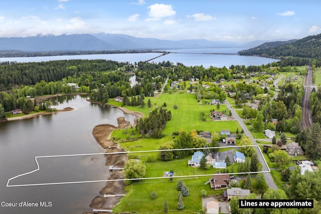 291 Comeback Bay Ln, Sagle, ID 83860 - aerial view of property's location featuring a water and mountain view, property parcel outlined, and a forest