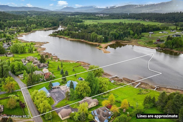 291 Comeback Bay Ln, Sagle, ID 83860 - aerial overview of property's location with a water and mountain view, a forest, and property parcel outlined